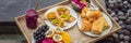 Breakfast on a tray with fruit, buns, avocado sandwiches, smoothie bowl by the pool. Summer healthy diet, vegan Royalty Free Stock Photo