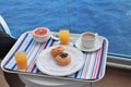 Breakfast tray on a table on a cruise ship balcony