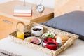 Breakfast Tray on Unmade Bed in Hotel Room Royalty Free Stock Photo