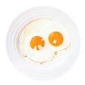 Breakfast with two fried eggs in white plate Royalty Free Stock Photo