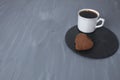 breakfast on Valentine\'s Day coffee biscuits heart on tray black on a gray background with a place for text copyspace. Food