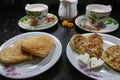 Breakfast on Valentine`s Day - fried omelete, bread, apple and White cheese in the shape of a heart coffe and milk. Royalty Free Stock Photo