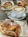 Breakfast on Valentine`s Day warm croissants and Coffee with a heart Royalty Free Stock Photo