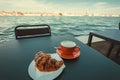 Breakfast in Venice with fresh crispy croissant and coffee. Morning in historical italian city at terrace of hotel