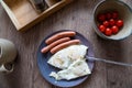 Breakfast view from above. Scrambled eggs with sausages and tomatoes Royalty Free Stock Photo