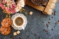 A cup of coffee with pieces of cane sugar, biscuits with chocolate and a vase with coffee beans. Top Royalty Free Stock Photo