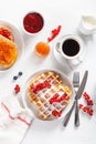 Breakfast with waffle, toast, berry, jam, chocolate spread and coffee. Top view Royalty Free Stock Photo