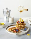 breakfast with waffles, strawberries, ice cream scoop and honey Royalty Free Stock Photo