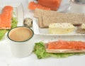 Breakfast for two,breakfast on a white background, a breakfas tcoffee, a toast with red fish, red fish and coffee