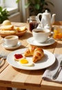 Breakfast by the window. On the wooden table: a croissant, a fried egg, a cup of coffee Royalty Free Stock Photo