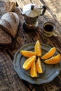 Breakfast on the wooden table. Coffee pot, cup of coffee, rye br Royalty Free Stock Photo