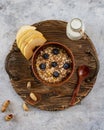 Breakfast on a wooden tray with metal handles: granola, milk, berries and fruits. View from above. Royalty Free Stock Photo