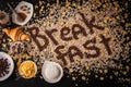 Breakfast word made by chocolate crispy ball on the muesli background with breakfast attributes Royalty Free Stock Photo