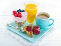 Breakfast with yoghurt, berries, juice, toast and coffee Royalty Free Stock Photo