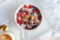 Breakfast yogurt and granola bowl topped with berries Royalty Free Stock Photo