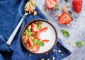 Breakfast with yogurt, granola of muesli and strawberries on gray concrete table background Royalty Free Stock Photo