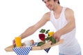 Breakfast - young man holding tray with rose Royalty Free Stock Photo