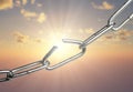 Breaking chain over sunrise background sky, breaking free, freedom, success or power concept