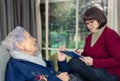 Breaking Isolation: Dedicated Social Worker Provides Eager Elderly Client Rare Platform to Voice Concerns and Shape Care. Royalty Free Stock Photo