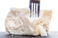 Breaking semisoft crumbly feta with a fork