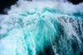 Breaking turquoise wave, splashing water drops, very sharp