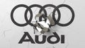 Breaking wall with painted logo of Audi. Crisis conceptual editorial 3D rendering Royalty Free Stock Photo