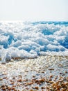 Breaking Wave of Blue Ocean on Pebbles beach Summer Background Royalty Free Stock Photo