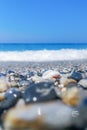 Breaking Wave of Blue Ocean on Pebbles beach Summer Background Royalty Free Stock Photo