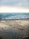 Breaking Wave of Blue Ocean on Pebbles beach Summer Royalty Free Stock Photo