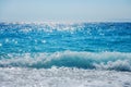 Breaking Wave of Blue Ocean on sandy beach Summer Background Royalty Free Stock Photo