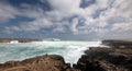 Breaking wave crashing into Laie Point coastline at Kaawa on the North Shore of Oahu Hawaii United States Royalty Free Stock Photo