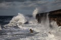 Breaking waves over Holyhead Breakwater