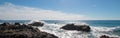 Breaking waves on rocky coastline at Cerritos Beach between Todos Santos and Cabo San Lucas in Baja California Mexico