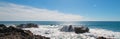 Breaking waves on rocky coastline at Cerritos Beach between Todos Santos and Cabo San Lucas in Baja California Mexico