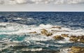 Breaking waves on stones in the sea