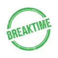 BREAKTIME text written on green grungy round stamp