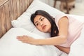 Frustrated Korean Woman Touching Empty Pillow Lying In Bed Indoor Royalty Free Stock Photo