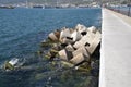 Breakwater of the rectangular stone figures. Royalty Free Stock Photo