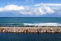 Breakwater and clouds Royalty Free Stock Photo