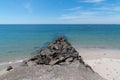 Breakwater ears of anti-erosion rocks in Noirmoutier VendÃÂ©e West of France Royalty Free Stock Photo