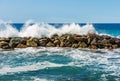 Breakwater in Liguria Italy - Large Waves of the Sea Break on the Rocks Royalty Free Stock Photo