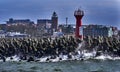 Breakwater made of concrete polygons in front of the lighthouse in the port of the Polish city of KoÃâobrzeg