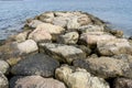 Breakwater by the Mediterranean sea on the island of Ibiza in Sp Royalty Free Stock Photo