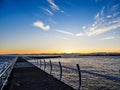 Breakwater at the Ogden Point in Victoria, BC, Canada; sunset ti