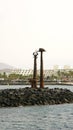 Breakwater with sculpture of Toys by Erjo in Lanzarote