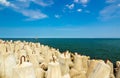 Breakwater on the sea, ship in the distance Royalty Free Stock Photo