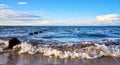 Breakwater with seagulls in the Baltic Sea. In the background the harbor of Glowe. Mecklenburg-Vorpommern Royalty Free Stock Photo