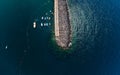 Breakwater, stones and embankment. Top view, Summer sea beach. Parking for boats. Storm embankment. Boats and fishermen. People ar Royalty Free Stock Photo