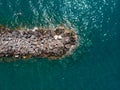 Breakwater, stones and embankment. Top view, Summer sea beach. Parking for boats. Storm embankment. Boats and fishermen. People ar Royalty Free Stock Photo
