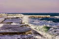 Breakwaters in the ice on frozen pier